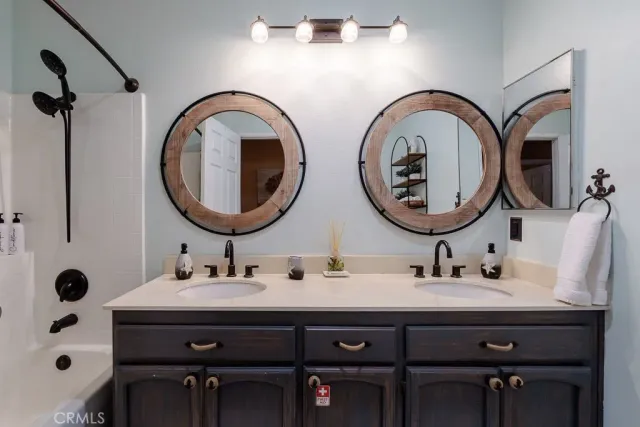 a bedroom with a bed and flat screen tv