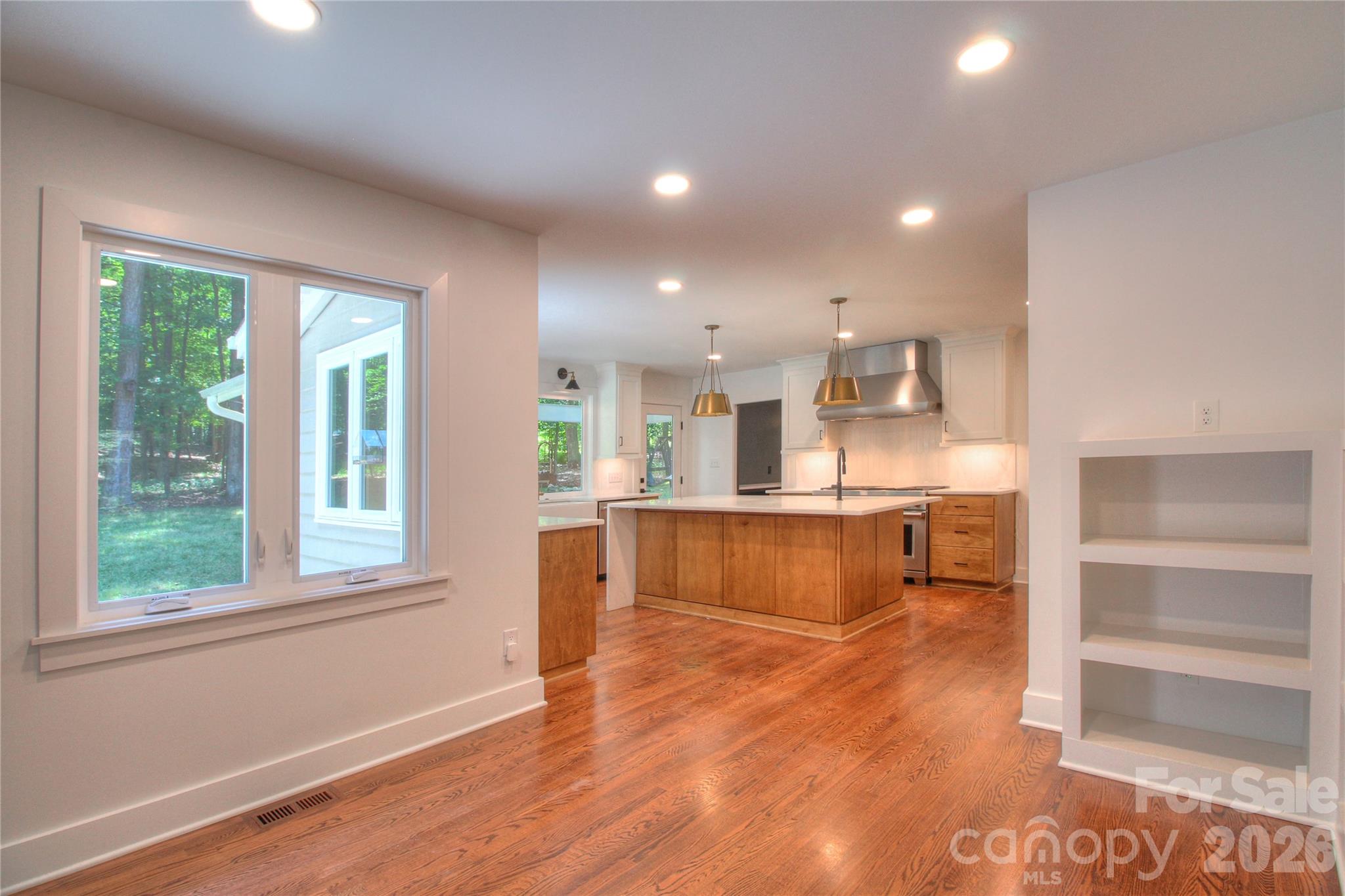 3408 Providence Manor Road Charlotte, NC 28270 - Photo 7 of 39 a view of kitchen with kitchen island refrigerator wooden floor and window