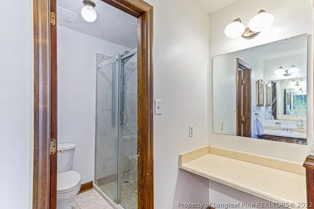 a bathroom with a tub and shower