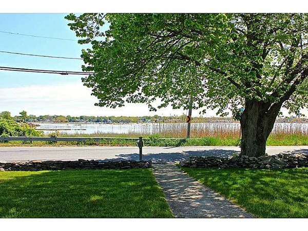 821 Pearse Road Swansea, MA 02777 - Photo 4 of 7 a view of a lake with a big yard