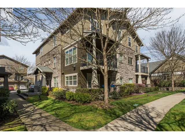a view of a big yard in front of a brick building
