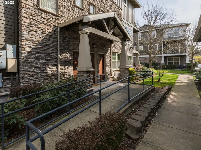 a view of a house with a yard and furniture