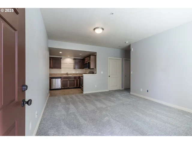 a view of a kitchen with a sink and a microwave