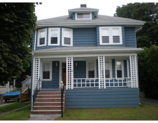 44 Chickatabot Road Quincy, MA 02169 - Photo 1 of 6 a view of a house with large windows and a yard