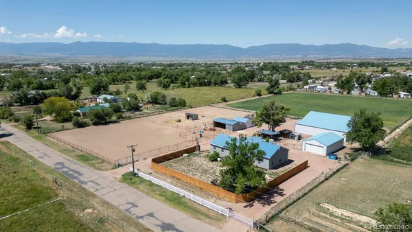 an aerial view of a house with a garden