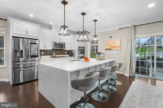 a spacious bedroom with a large bed and a flat screen tv