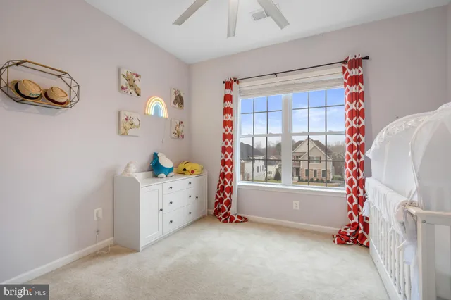a view of a roof deck with couches and wooden floor