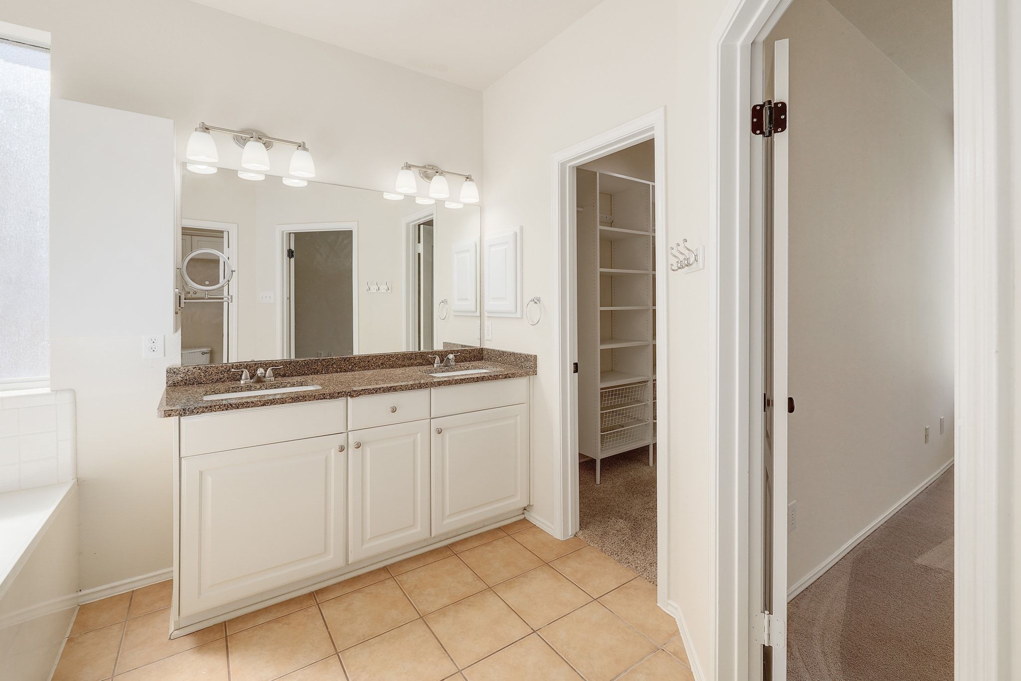 2307 Hayfield Square Pflugerville, TX 78660 - Photo 22 of 40 a bathroom with a double vanity sink and a mirror