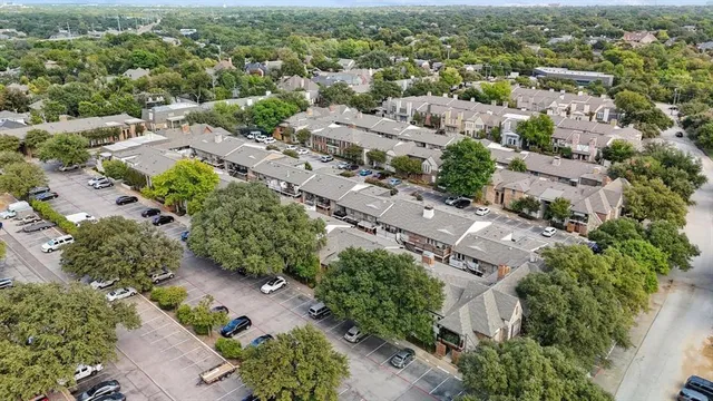 an aerial view of multiple house with a yard