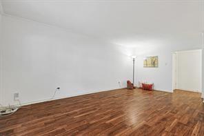 15914 Club Crest Drive, Unit 1112 Dallas, TX 75248 - Photo 29 of 35 a view of empty room with wooden floor