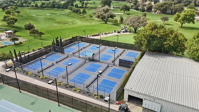 an aerial view of a residential houses with outdoor space