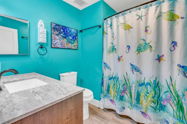 a bathroom with a sink double vanity and a mirror