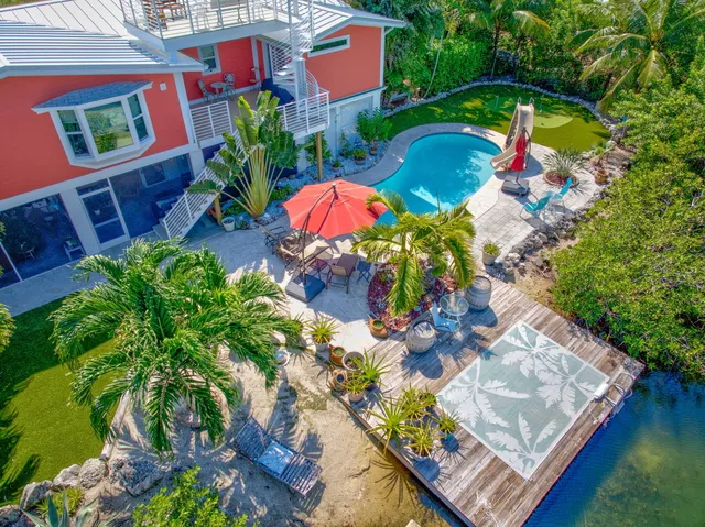 a backyard of a house with seating space