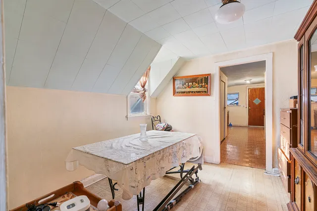 a room with a table and chairs