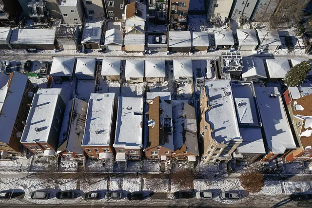 an aerial view of a city with lots of residential buildings