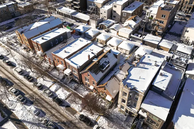 an aerial view of a building with lots of residential buildings