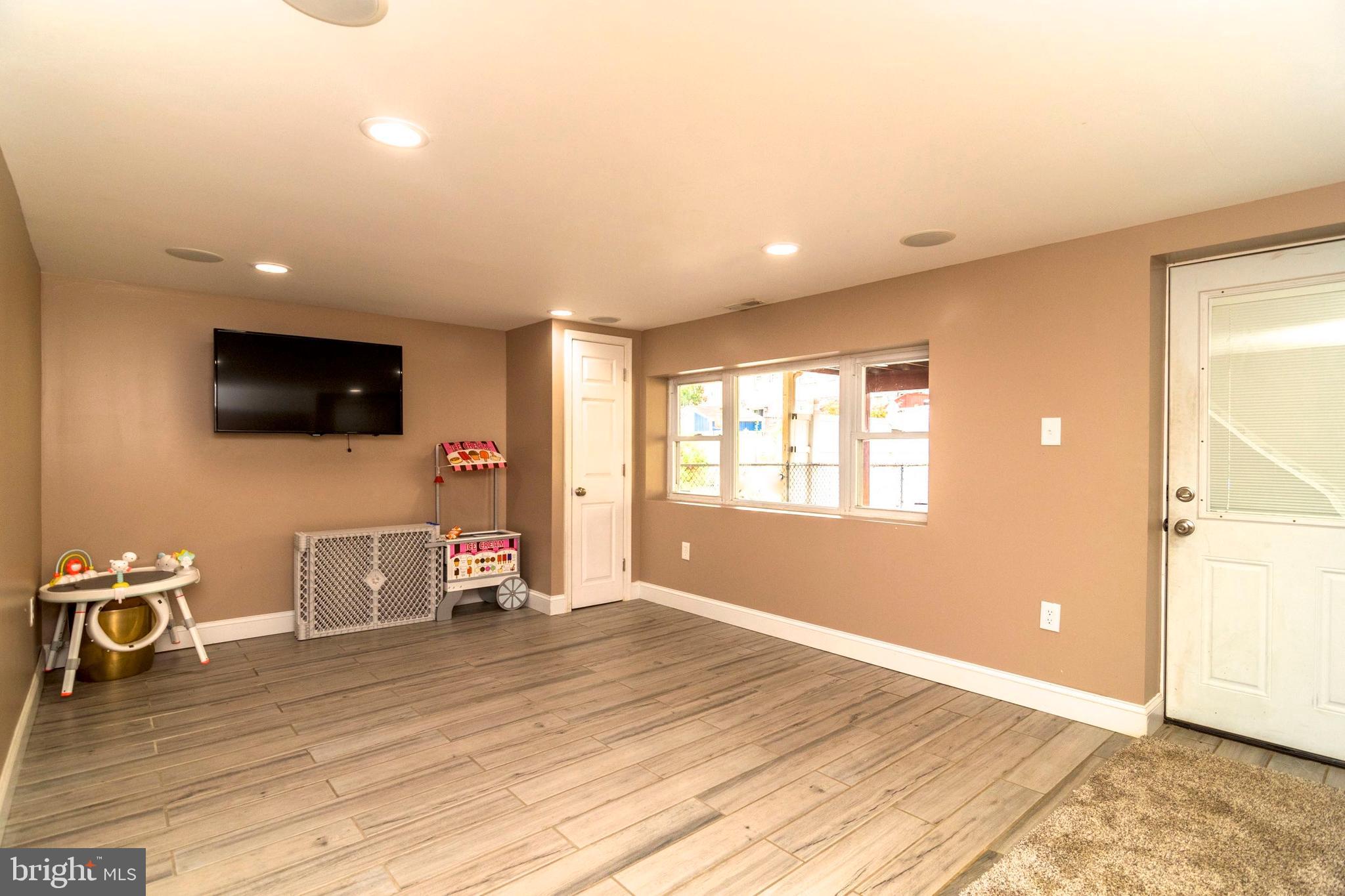 3560 Teton Road Philadelphia, PA 19154 - Photo 17 of 30 Family room with wood-look tile floor. Walk out.