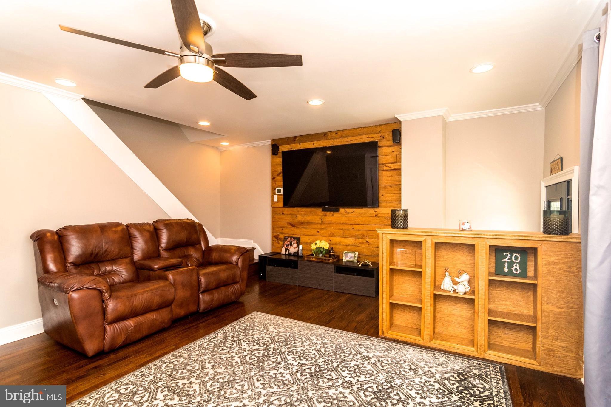 3560 Teton Road Philadelphia, PA 19154 - Photo 3 of 30 Living room with wood accent wall, wood floors