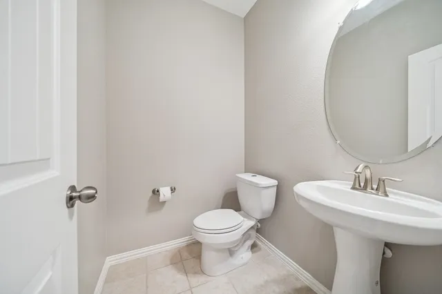 a spacious bathroom with a sink a mirror and a shower