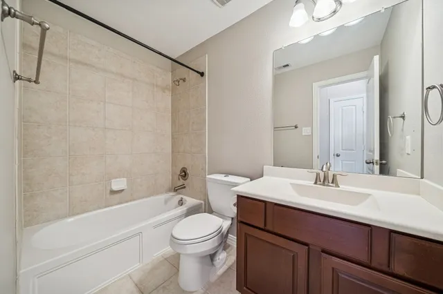 an aerial view of residential houses with outdoor space and lake view