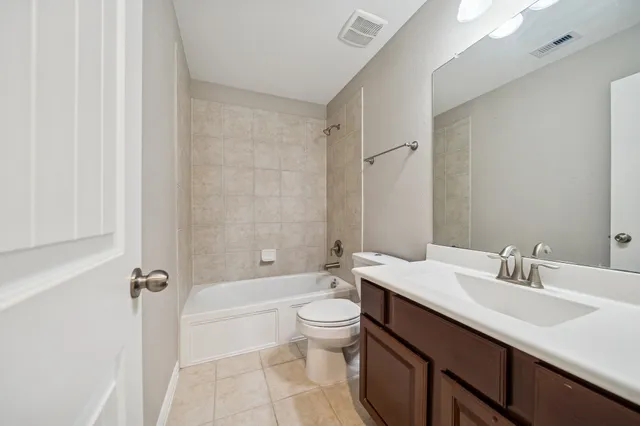 an aerial view of a house with outdoor space