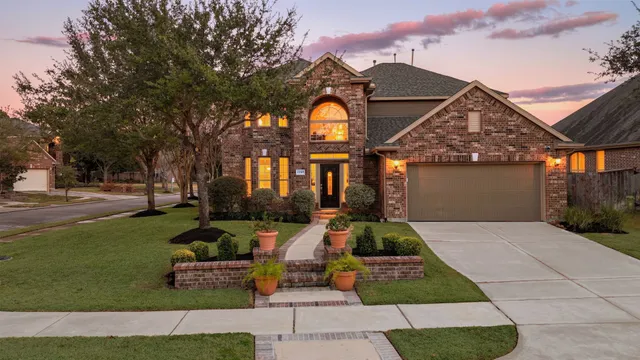 a kitchen with stainless steel appliances granite countertop a sink and a microwave