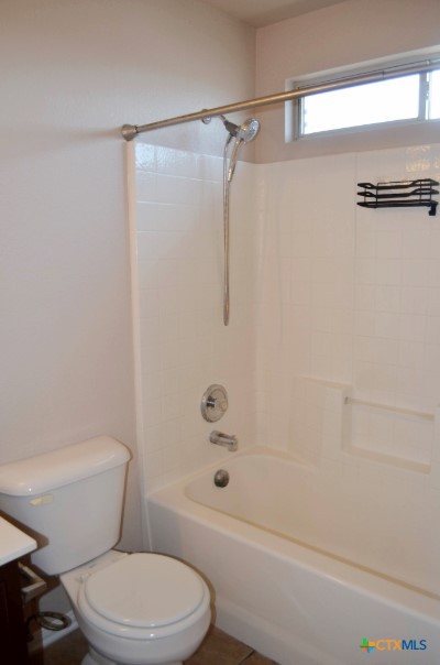 5406 Oster Drive Killeen, TX 76542 - Photo 11 of 46 a bathroom with a toilet and a shower