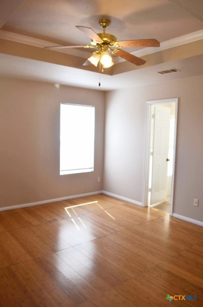 5406 Oster Drive Killeen, TX 76542 - Photo 22 of 46 a view of an empty room with window and wooden floor