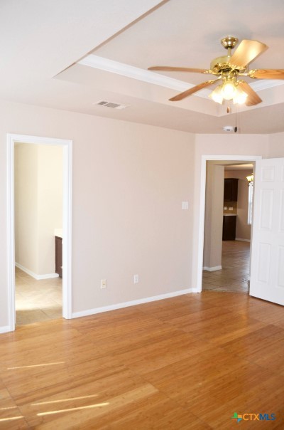 5406 Oster Drive Killeen, TX 76542 - Photo 23 of 46 a view of a livingroom with a ceiling fan window and wooden floor