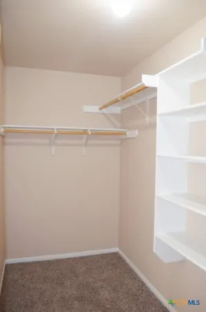 an empty room with closet area