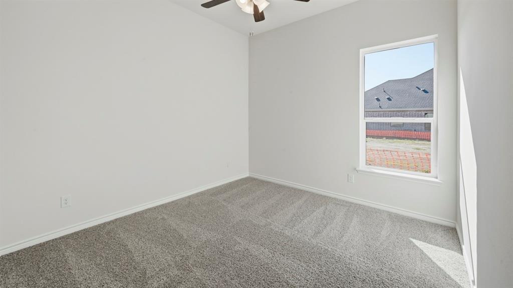 4163 Waldron Trail Forney, TX 75126 - Photo 20 of 30 Light gray carpet flooring, white painted walls, and a single window with white trim