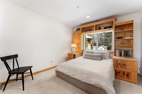 a bedroom with bed and window