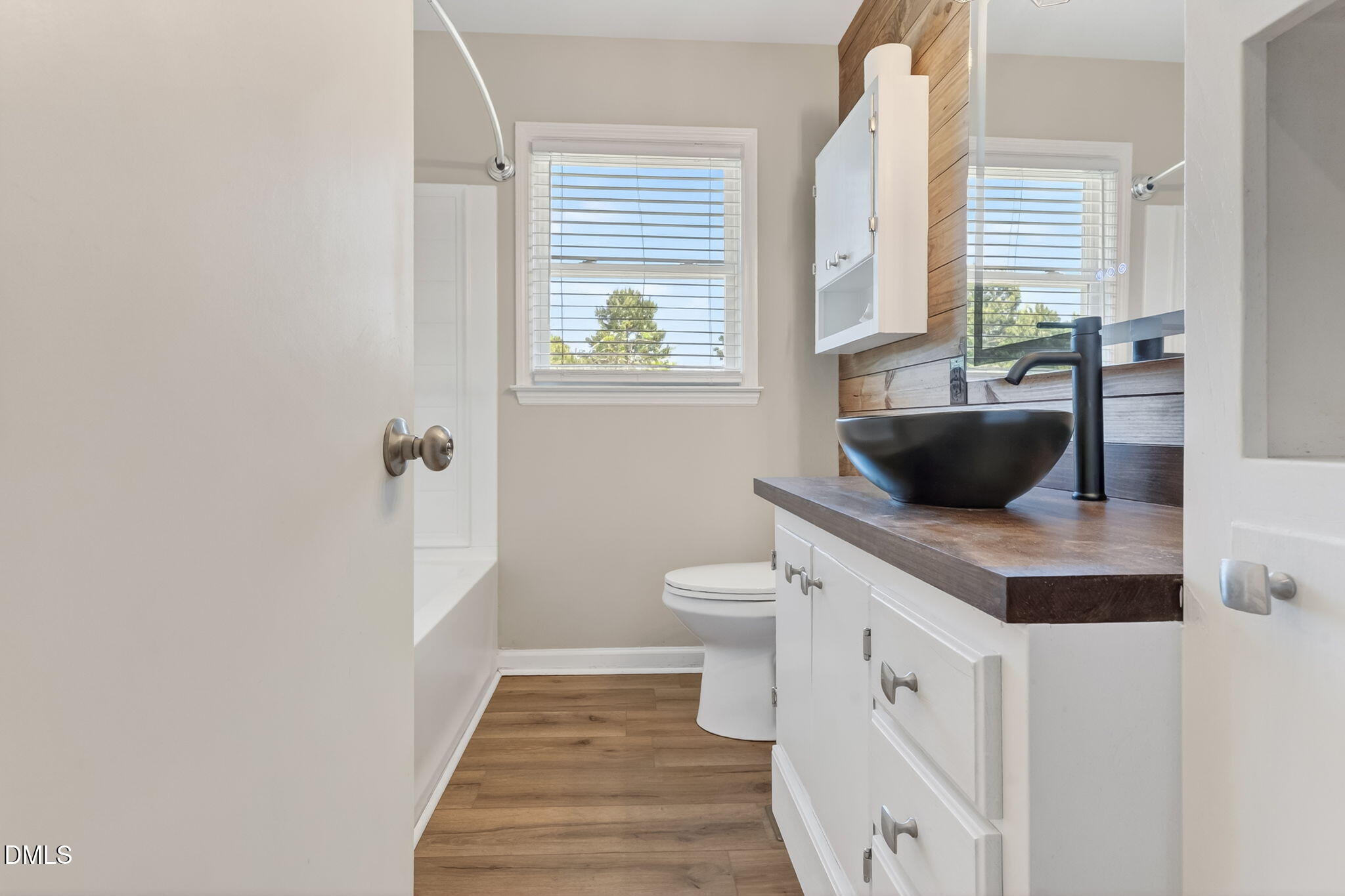 6086 Red Hill Church Road Coats, NC 27521 - Photo 15 of 44 a bathroom with a granite countertop sink and a toilet