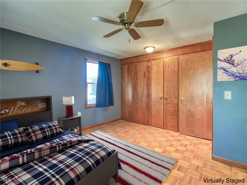 27133 Capel Road Columbia Station, OH 44028 - Photo 25 of 48 Bedroom with a ceiling fan large closet and wood floors