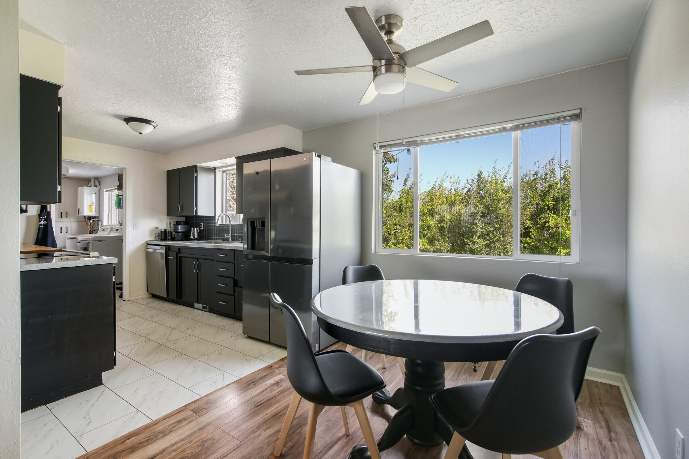 664 Southwest 35th Street Redmond, OR 97756 - Photo 6 of 19 a kitchen with kitchen island a dining table chairs stainless steel appliances and cabinets