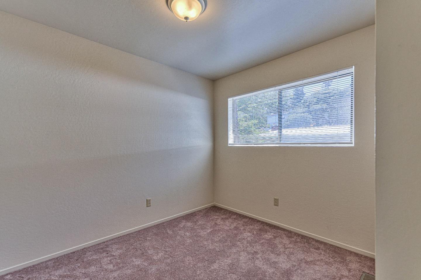 830 Parcel Street Monterey, CA 93940 - Photo 12 of 18 an empty room with a window
