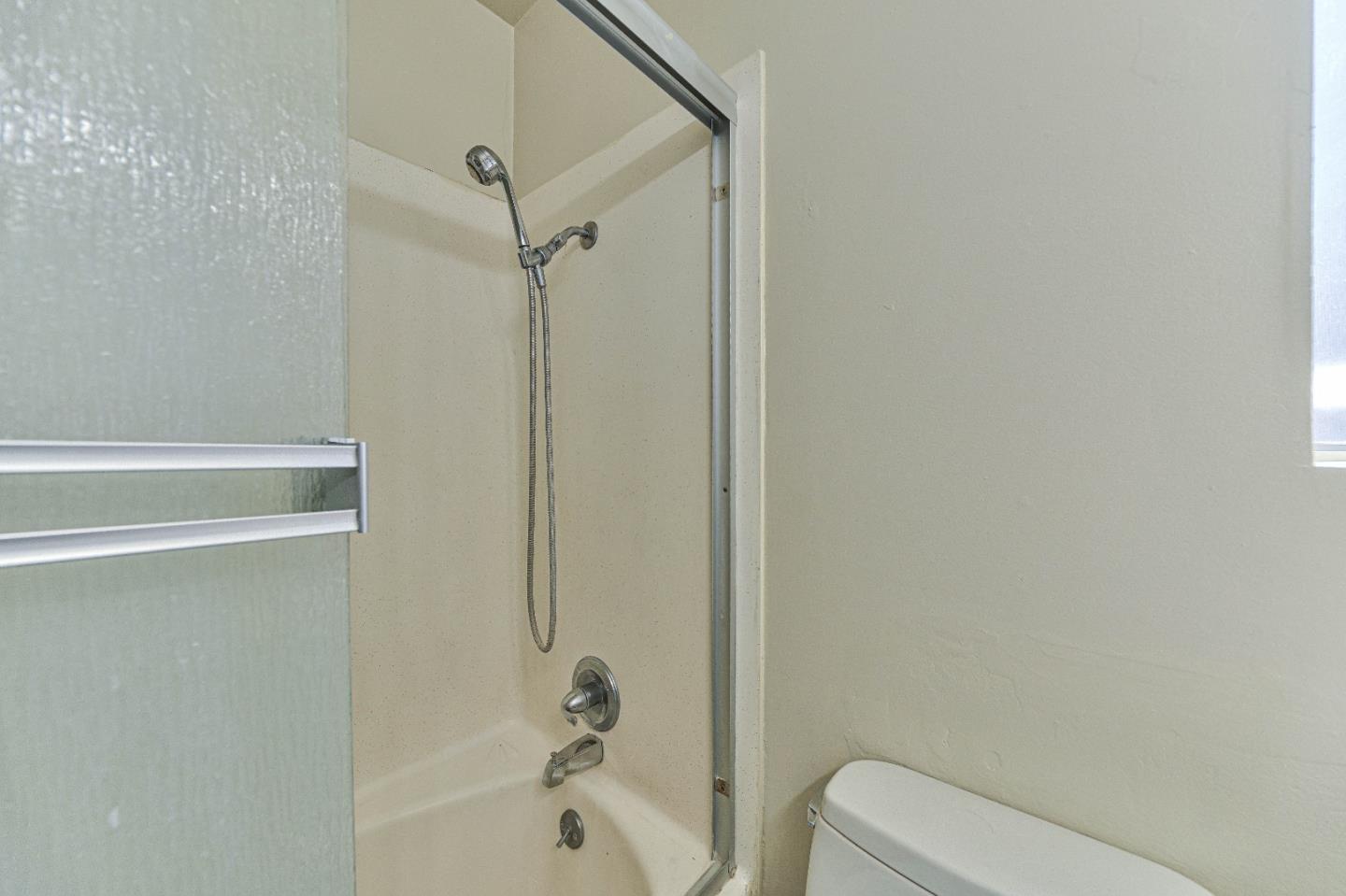 830 Parcel Street Monterey, CA 93940 - Photo 15 of 18 a bathroom with a shower and a bathtub
