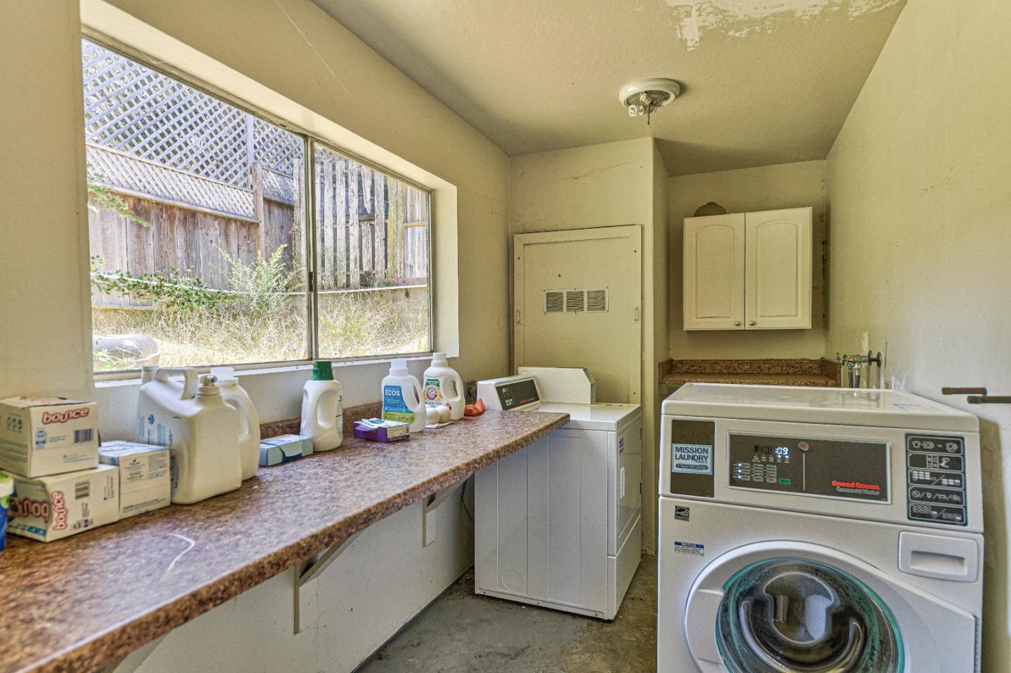 830 Parcel Street Monterey, CA 93940 - Photo 16 of 18 a kitchen with a sink cabinets and window