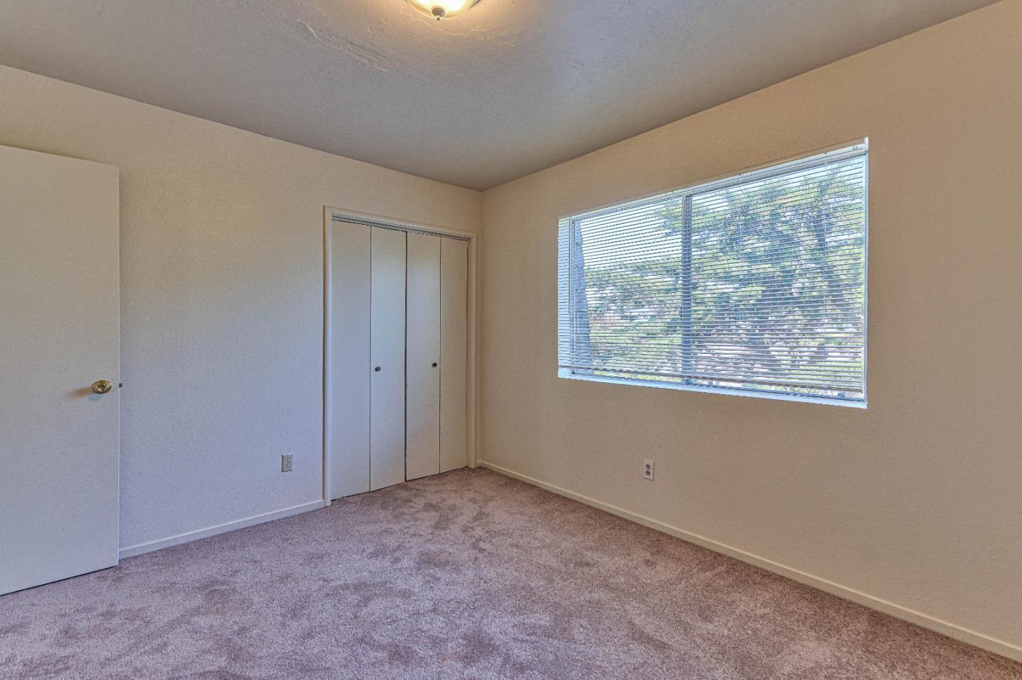 830 Parcel Street Monterey, CA 93940 - Photo 10 of 18 a view of an empty room with a window