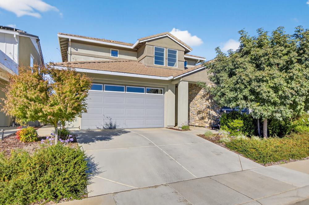 12086 Mircado Way Rancho Cordova, CA 95742 - Photo 2 of 84 a front view of a house with a yard