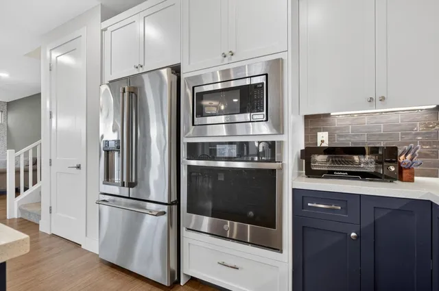 a view of a hallway with washer and dryer