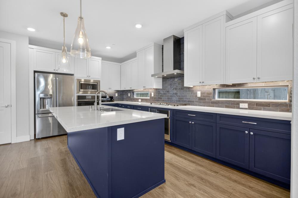 12086 Mircado Way Rancho Cordova, CA 95742 - Photo 25 of 84 a kitchen with stainless steel appliances granite countertop a sink a stove and a refrigerator