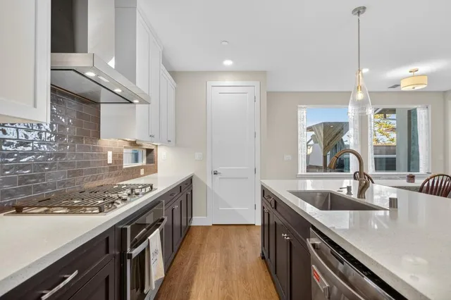 a view of staircase with white walls and a window