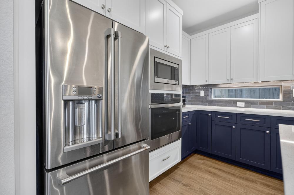 12086 Mircado Way Rancho Cordova, CA 95742 - Photo 30 of 84 a kitchen with stainless steel appliances granite countertop a refrigerator a stove and a sink
