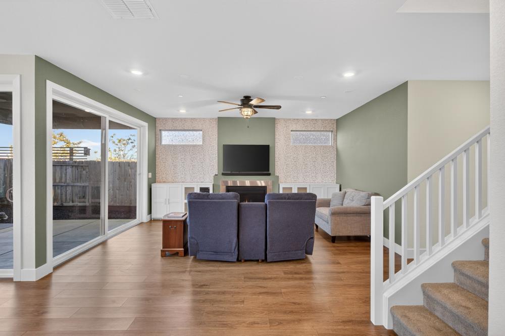 12086 Mircado Way Rancho Cordova, CA 95742 - Photo 32 of 84 a living room with furniture and a flat screen tv