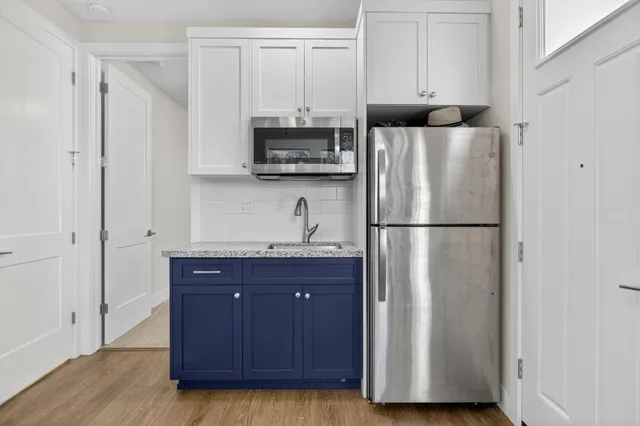 a bathroom with a bathtub and shower