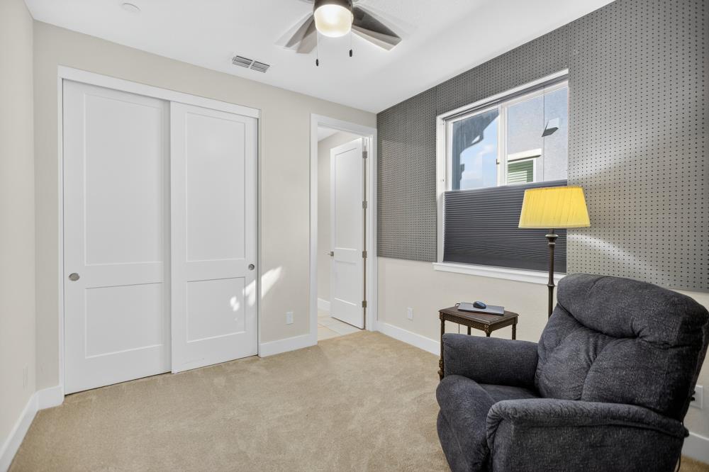 12086 Mircado Way Rancho Cordova, CA 95742 - Photo 37 of 84 a living room with furniture and a lamp