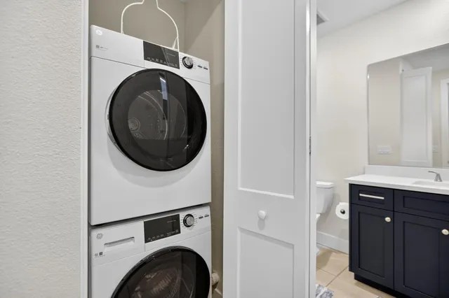 a bathroom with a granite countertop sink mirror and double