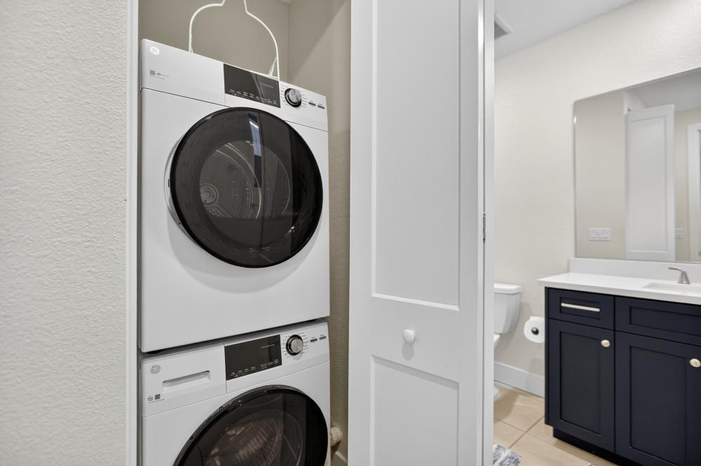 12086 Mircado Way Rancho Cordova, CA 95742 - Photo 39 of 84 a view of a hallway with washer and dryer