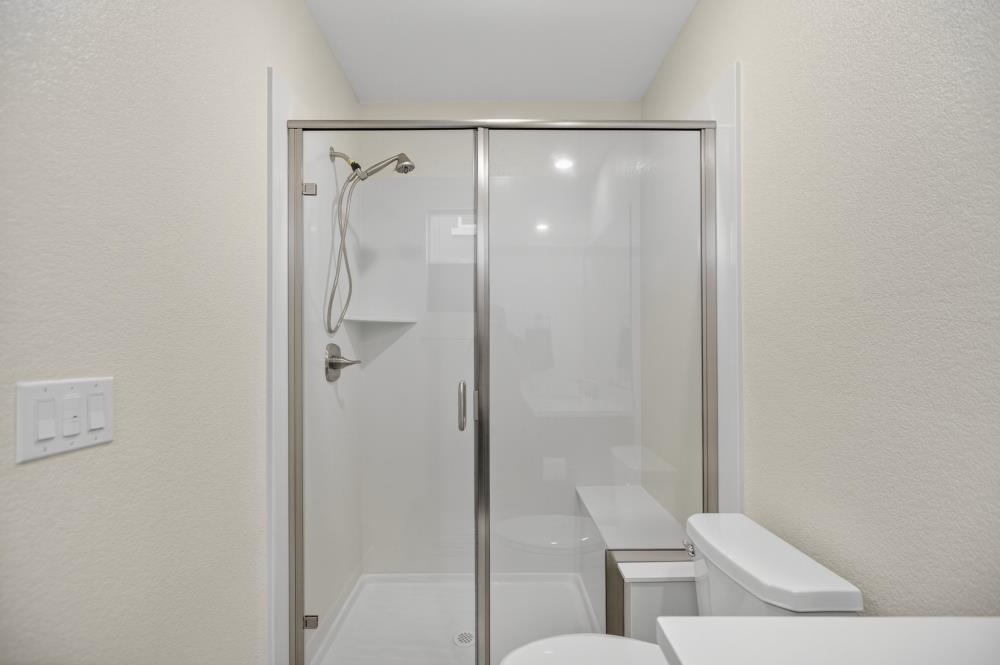 12086 Mircado Way Rancho Cordova, CA 95742 - Photo 42 of 84 a bathroom with a shower and toilet